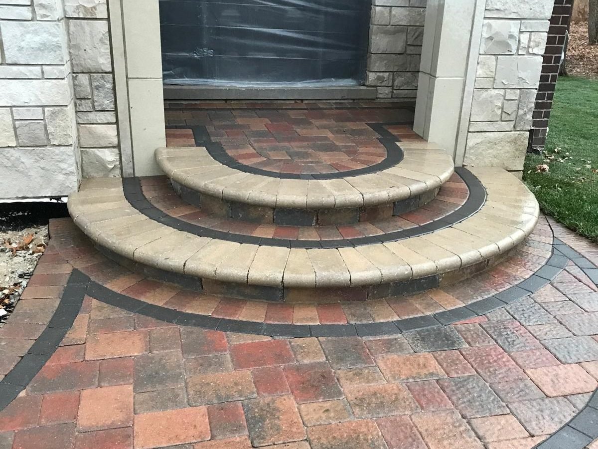 walkway-curved-paver-entry-steps-concentric-soldier-course-warm-multi-tone-brick-stone-home-2